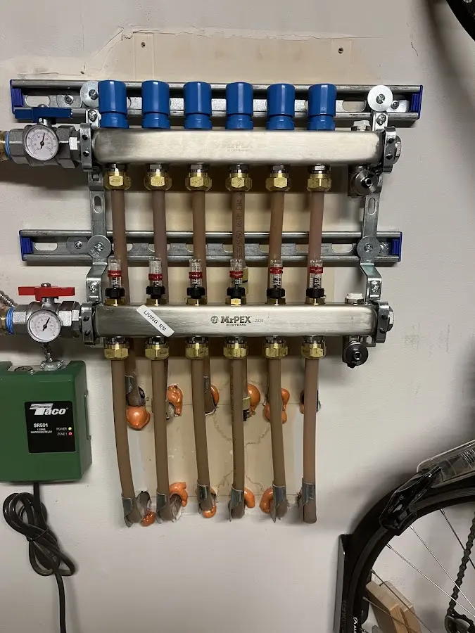 Plumber performing Water Heater Repair at a residential property in Manteno